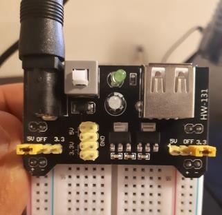 Breadboard power board with yellow jumper positions shown.