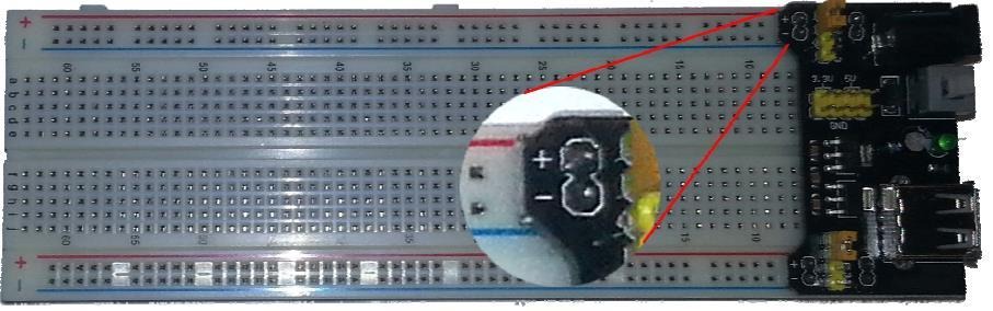 Breadboard power board installed on a breadboard.